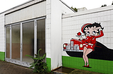 Abandoned car repair shop with a drive-in restaurant, advertising character painted on the wall, Krefeld, North Rhine-Westphalia, Germany, Europe