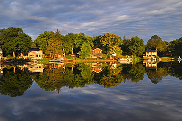 Houses reflected in the lake, Okauchee Lake, Wisconsin, USA