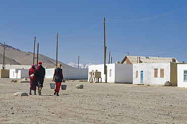 Women coming from a well, water reservoir in a village, Karakul, Tajikistan, Central Asia