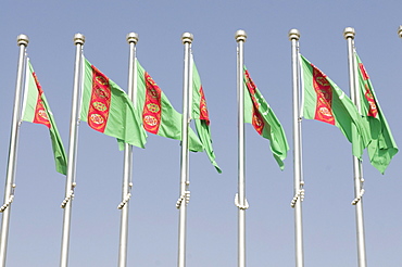 Turkmen national flags blowing in the wind, Ashgabat, Turkmenistan, Central Asia