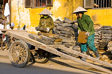 Workers moving bricks, Hoi An, Vietnam, Asia