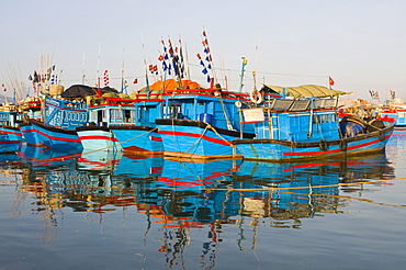 Blue fishing boats in the harbour of Nha Trang, Vietnam, Asia