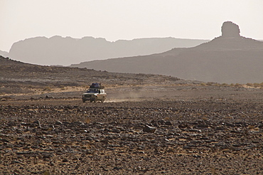 Off-road vehicle in rock landscape, Tasset, Algeria, Africa