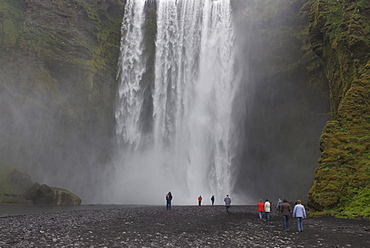 Tourists at the Skogafoss waterfall, Iceland, Europe