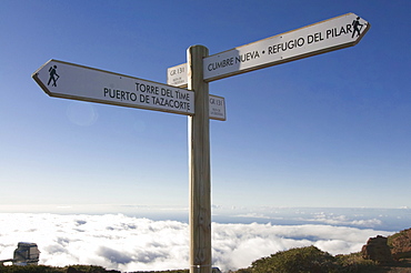 Signpost above the clouds on the rim of the Volcano de Taburiente, La Palma, Canaray Islands, Spain, Europe