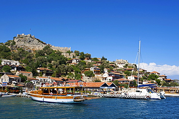 Castle and scenic restaurants in Kale Simena, Lycia, southern coast of Turkey, Western Asia