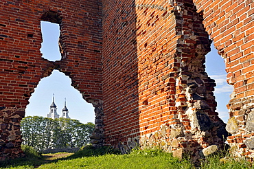 Castle ruins, Castle of the Teutonic Knights, the remains of the gatehouse, view towards St. Mary's Church, Ludza, Latvia, Europe