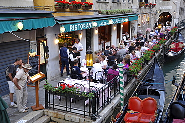 Ristorante da Raffaele in San Marco, a restaurant on a canal with guests and gondolas, Venice, Venice, Italy, Europe