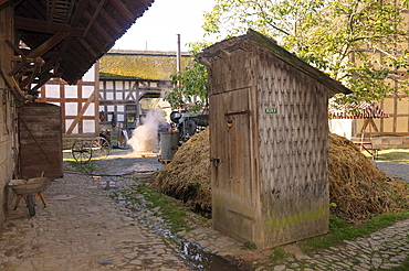 Outhouse, toilet next to the dung heap on a farm, Europa Park near Neu-Anspach, Hochtaunuskreis district, Hesse, Germany, Europe