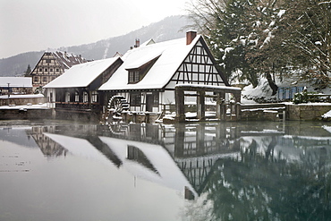 Mill reflected in the Blautopf spring, Blaubeuren, Swabian Alb, Baden-Wuerttemberg, Germany, Europe