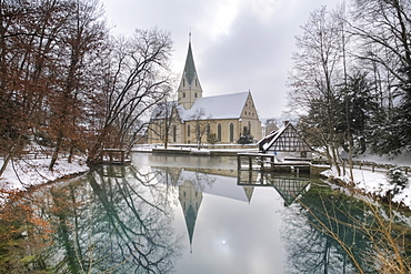 Monastery church reflected in the Blautopf spring, Kloster Blaubeuren monastery, Blaubeuren, Swabian Alb, Baden-Wuerttemberg, Germany, Europe