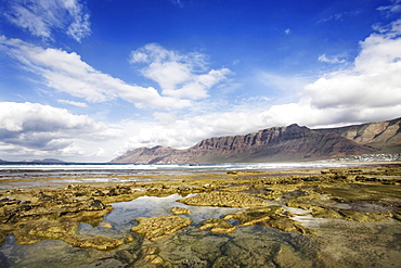 Famara Beach with views across to Famara Massiv, Lanzarote, Canary Islands, Spain, Europe