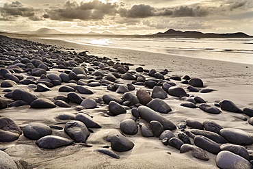 Stones and rocks polished smooth by the sea at Famara Beach, Lanzarote, Canary Islands, Spain, Europe