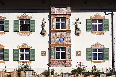 Facade of a villa built in Bavarian country house style in 1921, bay window with mural paintings called Lueftlmalerei, Fruehlingstrasse street, Garmisch district, Garmisch-Partenkirchen, Werdenfelser Land region, Upper Bavaria, Bavaria, Germany, Europe