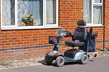 Mobility scooter parked outside a house