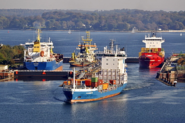 Shipping container ships at Holtenau lock, Kiel Canal, Kiel, Schleswig-Holstein, Germany, Europe