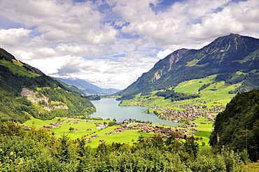 View over Lungernsee Lake into Sameraatal valley, a natural dam below the Bruenigpass, Canton of Obwalden, Switzerland, Europe