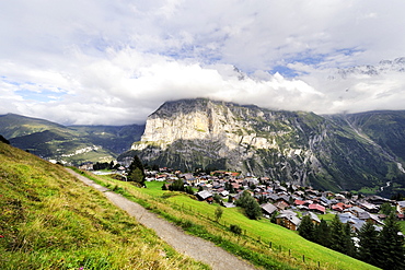 View of the traditional car-free Walser mountain village of Muerren above the Lauterbrunnen Valley and opposite of Staldenfluh Mountain, Canton of Bern, Switzerland, Europe