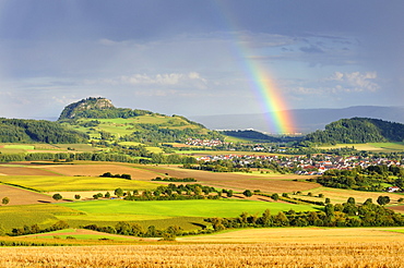 View on Mt. Hohentwiel and a rainbow, Hegau region, Landkreis Konstanz county, Baden-Wuerttemberg, Germany, Europe