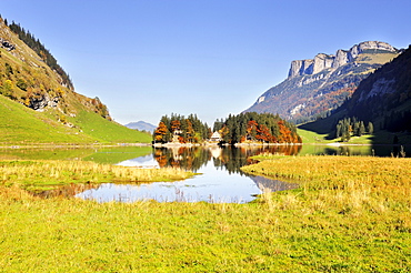 View from the west over Seealp Lake, at 1143 m altitude, towards Forelle mountain guesthouse, Canton of Appenzell Inner-Rhodes, Switzerland, Europe