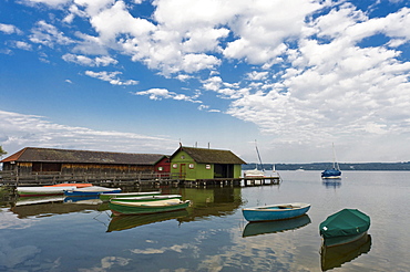 Boathouses and small boats on the Lake Ammersee at Schondorf, Bavaria, Germany, Europe