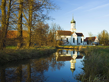 St. John's Church reflected in the Schmutter River, Dietkirch near Gessertshausen, Swabia, Bavaria, Germany, Europe