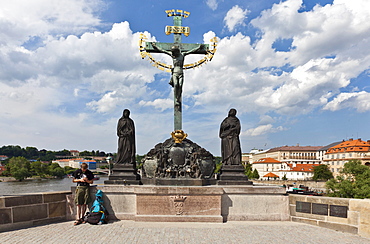 Bronze crucifix, Charles Bridge, Vltava river, UNESCO World Cultural Heritage, Prague, Czech Republic, Europe