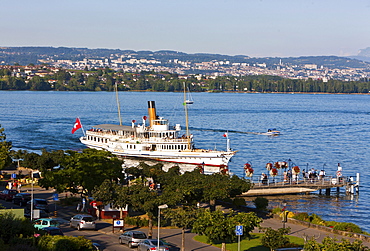 An old paddle-steamer as a ferry for tourists approaching a dock near Morges, canton of Vaud, Switzerland, Europe