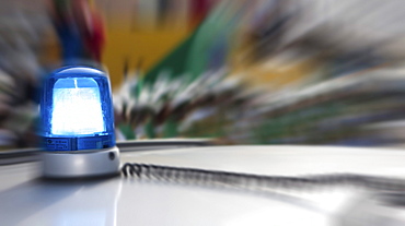 Blue flashing light on a police patrol car