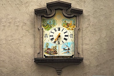 Wall clock from 1664 with painted motifs of the four seasons on a town house, Isny, Allgaeu, Bavaria, Germany, Europe