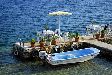 Cafe restaurant terrace on the waterfront in the village of Kale, Kalekoey or Simena, Kekova Bay, Lycian coast, Antalya Province, Mediterranean, Turkey, Eurasia