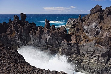 Surf on the rocky coast of Los Hervideros, volcanic landscape, Timanfaya National Park, Lanzarote, Canary Islands, Spain, Europe