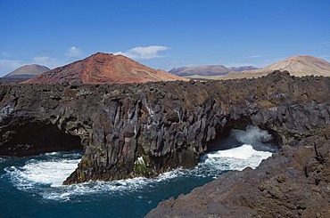 Surf on the rocky coast of Los Hervideros, volcanic landscape, Timanfaya National Park, Lanzarote, Canary Islands, Spain, Europe