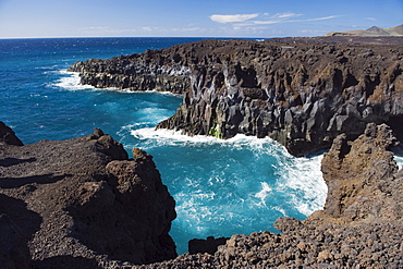 Surf on the rocky coast of Los Hervideros, volcanic landscape, Timanfaya National Park, Lanzarote, Canary Islands, Spain, Europe