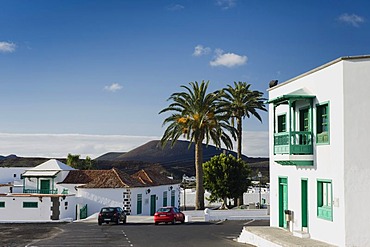 House with a typical Canarian balcony and date palms in Yaiza, Lanzarote, Canary Islands, Spain, Europe