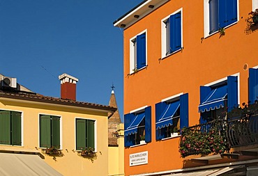 Brightly painted house facades, historic town centre of Caorle, Veneto, Italy, Europe