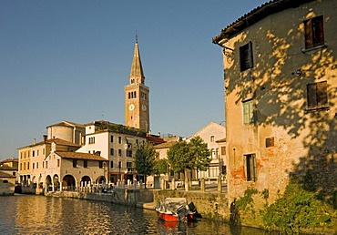 Historic district with leaning cathedral tower, Campanile pendente, and Lemene river, Portogruaro, Veneto, Italy, Europe