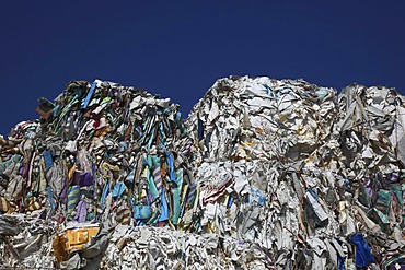 Used paper, stacks of used paper at a recycling yard, paper recycling