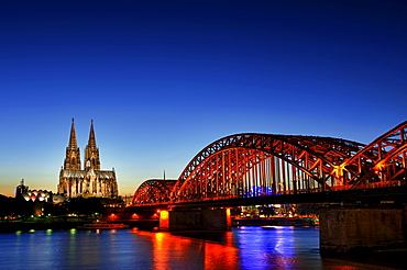 Cologne Cathedral at the blue hour with Hohenzollernbruecke railway bridge, Cologne, North Rhine-Westphalia, Germany, Europe