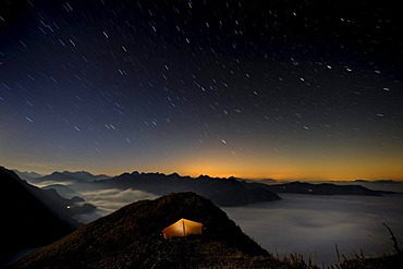 Tent on a peak af the blue hour, Allgaeu Alps, Kleinwalsertal valley, Vorarlberg, Austria, Europe