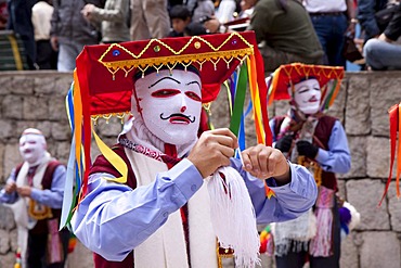 Man wearing a traditional costume at a parade in Aguas Calientes, Peru, South America