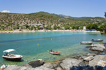 Boats in an idyllic bay near Alyki on the island of Thassos, Macedonia, Greece, Europe