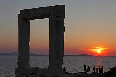 Sunset, Portara or gate of the Temple of Apollo, Naxos town, Naxos island, Cyclades, Aegean Sea, Greece, Europe