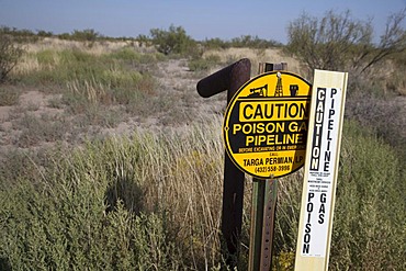 A sign warns of an underground natural gas pipeline in Grandfalls, west Texas, USA