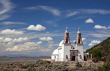 The Chapel of All Saints, at the end of a trail with sculptures showing the Stations of the Cross, on a hill above town, San Luis, Colorado, USA