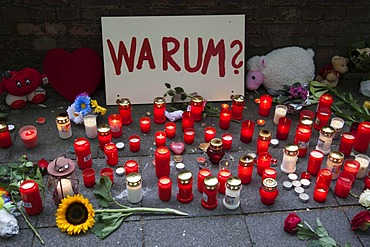 Sign saying "warum?", "why?", and candles to commemorate the victims of the stampede at the Love Parade 2010, Duisburg, Ruhr Area, North Rhine-Westphalia, Germany, Europe