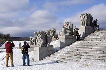 Tourists in front of sculptures in Vigeland Park, Oslo, Norway, Europe