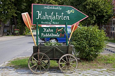 Wooden cart with sign advertising boat rides, Schlepzig, Spreewald, Spree Forest, Brandenburg, Germany, Europe