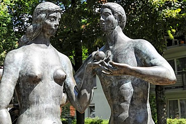 Sculptures of Adam and Eve in front of the Spitalmuehle mill, courtyard of the 'Heiliger Geist' Hospital, Schwaebisch Gmuend, Baden-Wuerttemberg, Germany, Europe