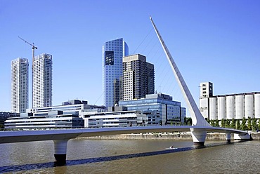 Puente de la Mujer, a modern suspension bridge, Women's Bridge and office towers in the old Puerto Madero harbor, Puerto Madero district, Buenos Aires, Argentina, South America